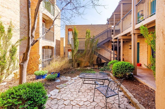 3431 N Hills Dr Unit 115, Austin, TX 78731 - view of patio featuring stairway