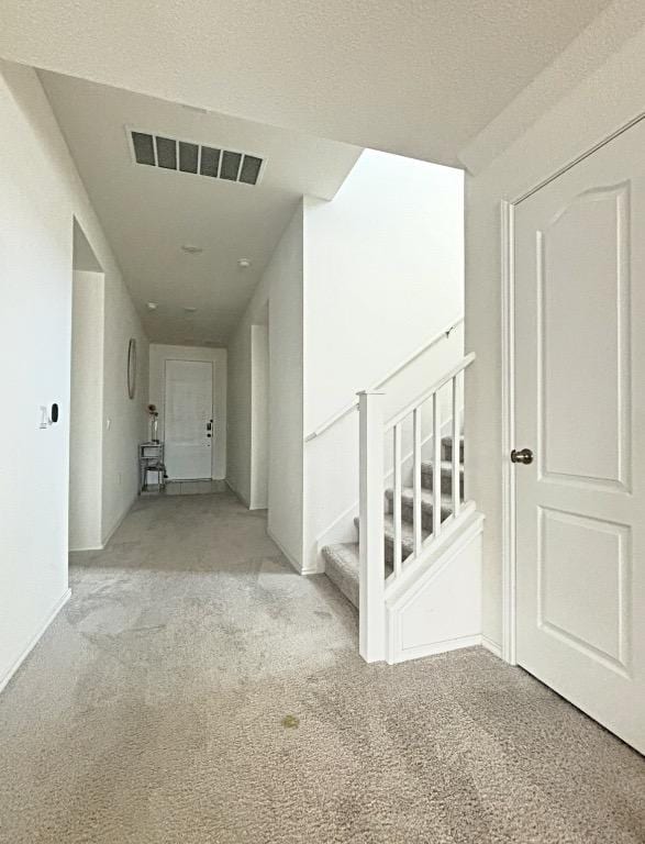 12637 Orchard Grove Ln, Manor, TX 78653 - hallway with light carpet and stairs