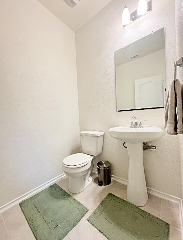 12637 Orchard Grove Ln, Manor, TX 78653 - bathroom with toilet and tile patterned flooring