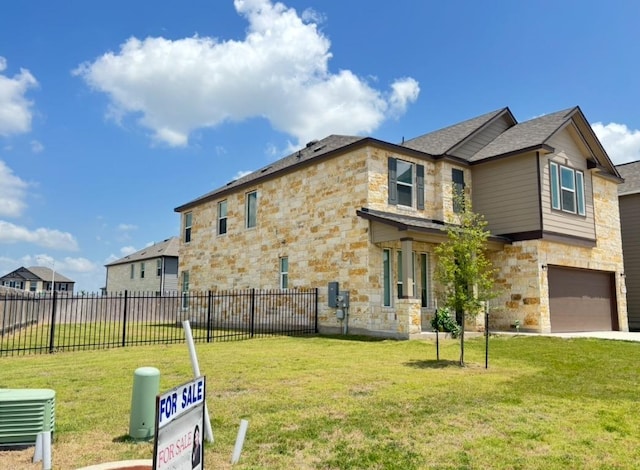 12637 Orchard Grove Ln, Manor, TX 78653 - view of front of house featuring stone siding and a garage