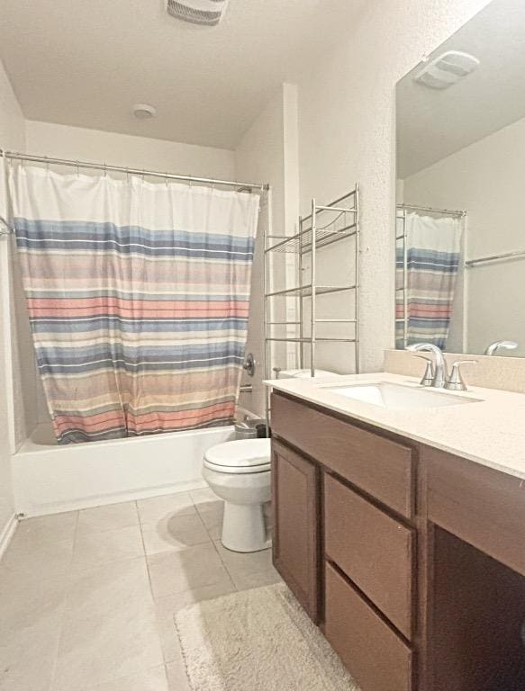 12637 Orchard Grove Ln, Manor, TX 78653 - full bathroom featuring vanity, shower / bath combo with shower curtain, and tile patterned floors