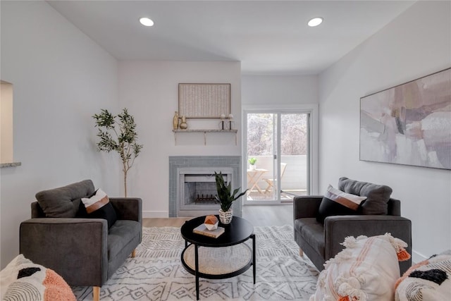 12166 Metric Blvd Unit 103, Austin, TX 78758 - living room featuring wood finished floors, a fireplace, and recessed lighting