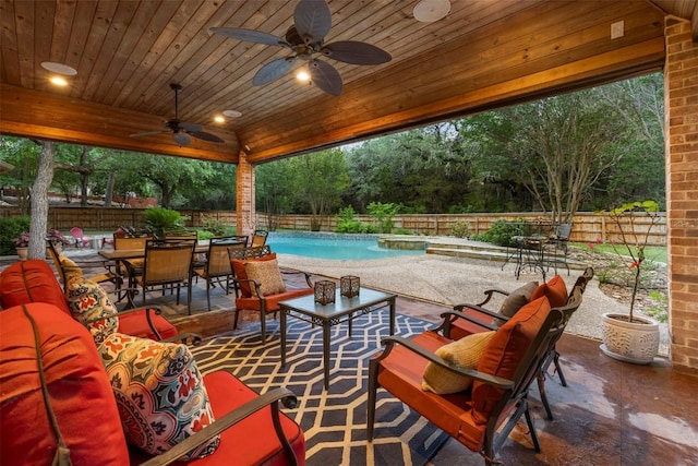 9920 Michelle Hl, Garden Ridge, TX 78266 - fenced backyard featuring a patio area, ceiling fan, outdoor dining space, and an outdoor hangout area