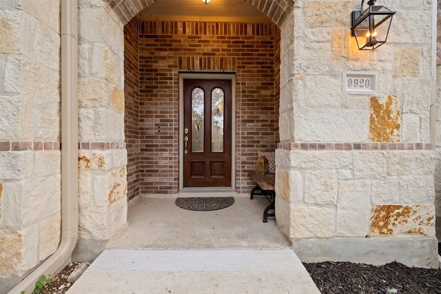9920 Michelle Hl, Garden Ridge, TX 78266 - doorway to property featuring stone siding and brick siding