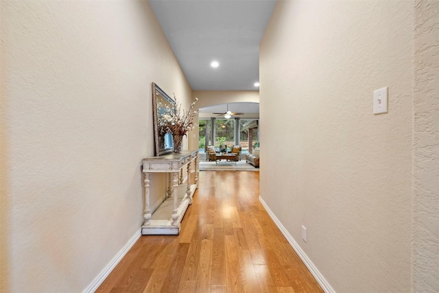 9920 Michelle Hl, Garden Ridge, TX 78266 - hall with light wood-style floors, recessed lighting, and arched walkways