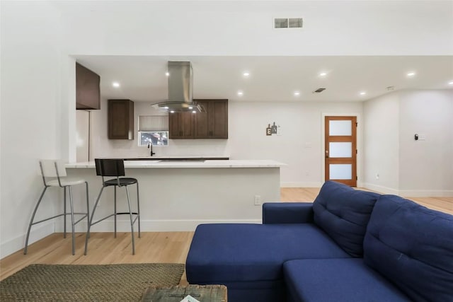 10410 Quail Ridge Dr, Austin, TX 78758 - living area with light wood-style flooring and recessed lighting