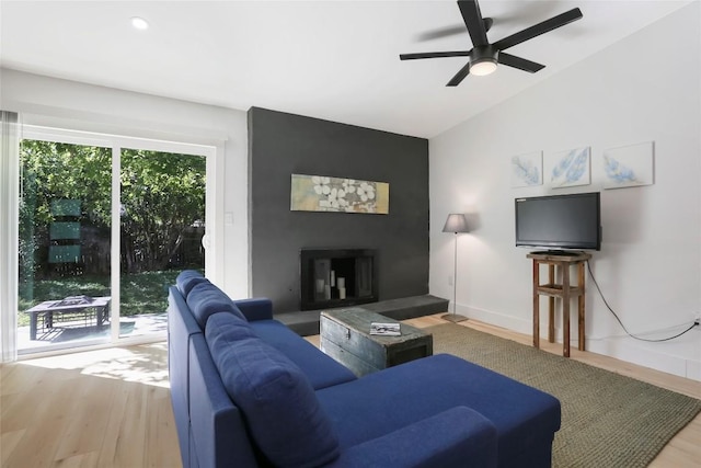 10410 Quail Ridge Dr, Austin, TX 78758 - living area with wood finished floors, a ceiling fan, vaulted ceiling, a large fireplace, and recessed lighting