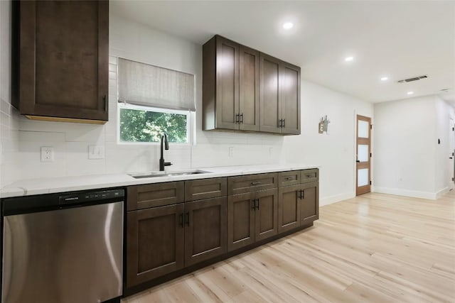 10410 Quail Ridge Dr, Austin, TX 78758 - kitchen with dishwasher, light countertops, light wood-type flooring, decorative backsplash, and recessed lighting