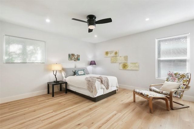 10410 Quail Ridge Dr, Austin, TX 78758 - bedroom featuring multiple windows, light wood-style flooring, a ceiling fan, and recessed lighting