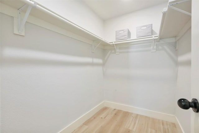 10410 Quail Ridge Dr, Austin, TX 78758 - spacious closet with light wood-style floors