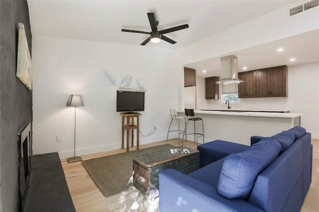 10410 Quail Ridge Dr, Austin, TX 78758 - living area with light wood-style floors, ceiling fan, and recessed lighting