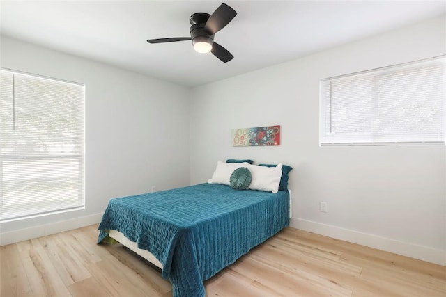 10410 Quail Ridge Dr, Austin, TX 78758 - bedroom featuring light wood finished floors and a ceiling fan