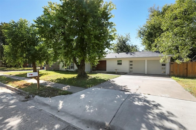 10410 Quail Ridge Dr, Austin, TX 78758 - view of front of house with a garage and concrete driveway