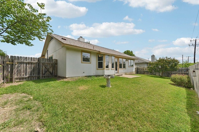 906 Jasmine Trl, Georgetown, TX 78626 - back of house with a fenced backyard, a patio, and a chimney