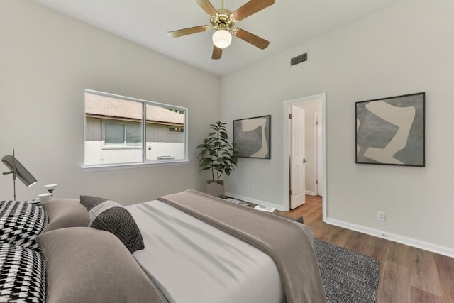 906 Jasmine Trl, Georgetown, TX 78626 - bedroom with wood finished floors and ceiling fan
