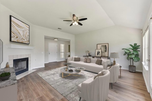 906 Jasmine Trl, Georgetown, TX 78626 - living area with light wood-type flooring, a fireplace, a ceiling fan, and lofted ceiling