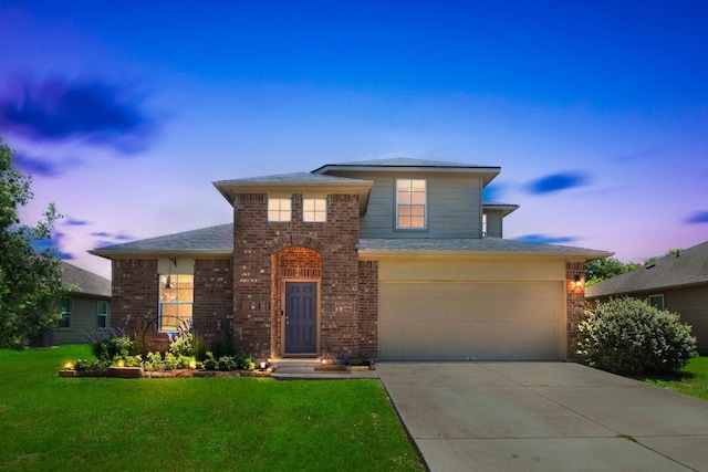 603 Luna Vista Dr, Hutto, TX 78634 - view of front of house with brick siding, a front lawn, driveway, and a garage