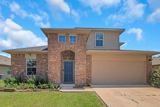 603 Luna Vista Dr, Hutto, TX 78634 - traditional home featuring brick siding, concrete driveway, a front yard, and roof with shingles