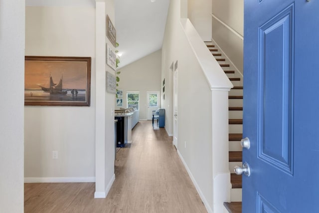 603 Luna Vista Dr, Hutto, TX 78634 - entryway featuring light wood-style floors, stairs, and vaulted ceiling