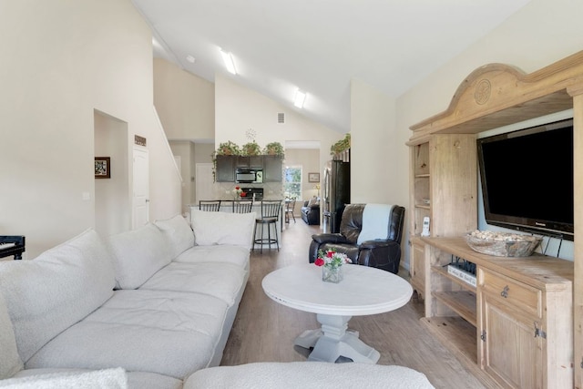 603 Luna Vista Dr, Hutto, TX 78634 - living room featuring light wood-type flooring and high vaulted ceiling