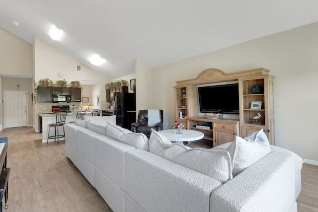 603 Luna Vista Dr, Hutto, TX 78634 - living room featuring light wood-style flooring and high vaulted ceiling