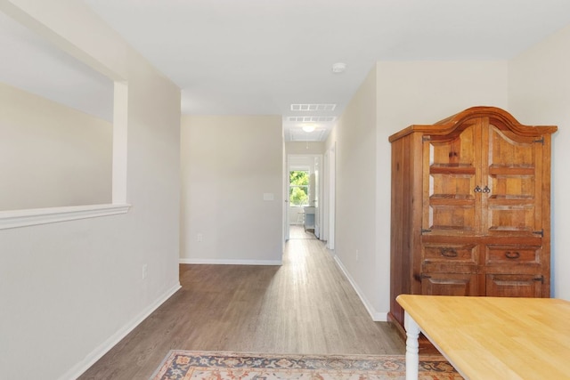 603 Luna Vista Dr, Hutto, TX 78634 - hall with wood finished floors and attic access