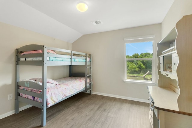 603 Luna Vista Dr, Hutto, TX 78634 - bedroom with wood finished floors and lofted ceiling