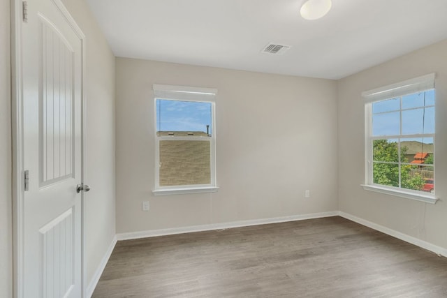 603 Luna Vista Dr, Hutto, TX 78634 - unfurnished room featuring wood finished floors and baseboards