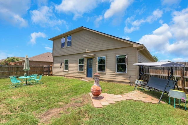 603 Luna Vista Dr, Hutto, TX 78634 - back of property with a fenced backyard and a patio