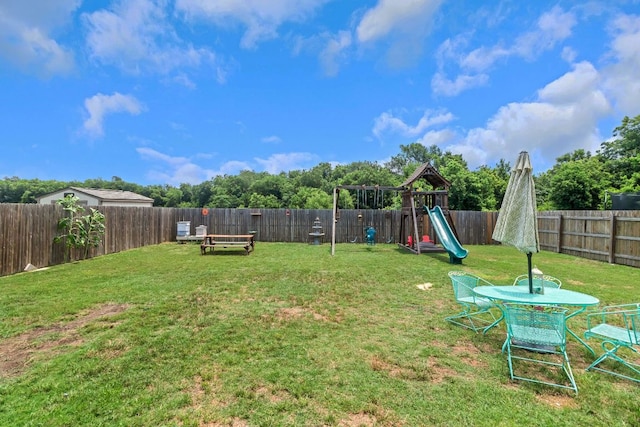 603 Luna Vista Dr, Hutto, TX 78634 - fenced backyard featuring a playground