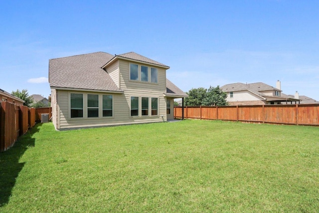 20025 Rhiannon Ln, Pflugerville, TX 78660 - back of house with a fenced backyard and roof with shingles
