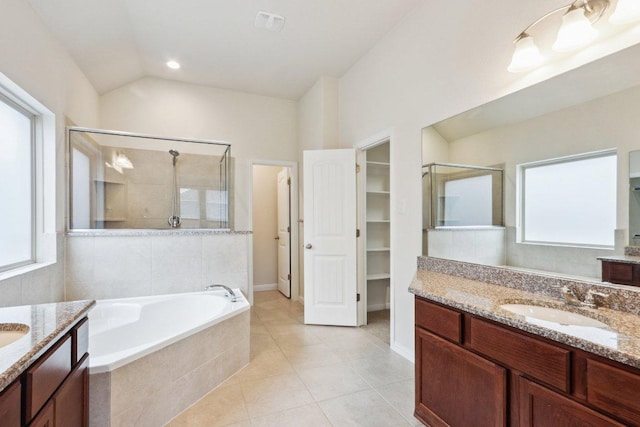 20025 Rhiannon Ln, Pflugerville, TX 78660 - bathroom with a stall shower, two vanities, plenty of natural light, and lofted ceiling