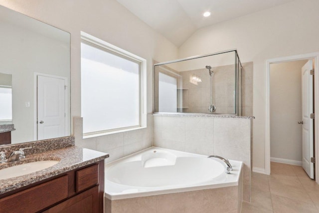 20025 Rhiannon Ln, Pflugerville, TX 78660 - full bath featuring vanity, a garden tub, a shower stall, tile patterned floors, and lofted ceiling