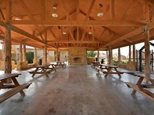 20025 Rhiannon Ln, Pflugerville, TX 78660 - view of community with a gazebo, high vaulted ceiling, a large fireplace, beamed ceiling, and a patio