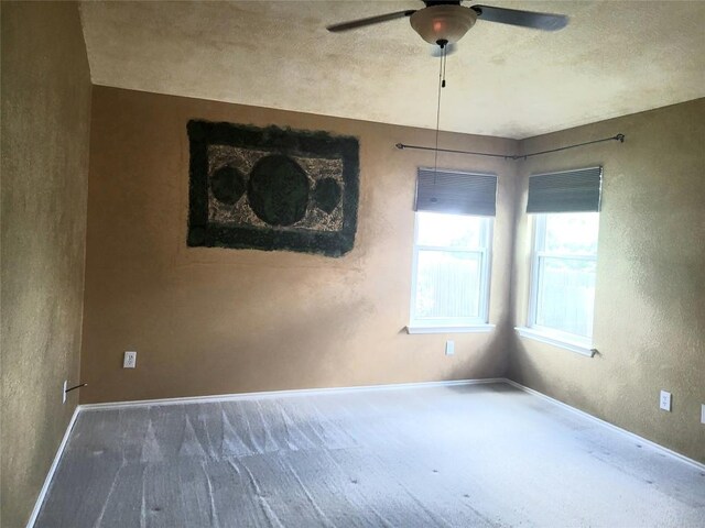 1013 Henderson Dr, Leander, TX 78641 - carpeted empty room with a ceiling fan and baseboards