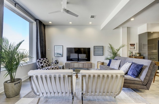 1800 E 4th St Unit 263, Austin, TX 78702 - living area featuring healthy amount of natural light, a ceiling fan, wood finished floors, and recessed lighting