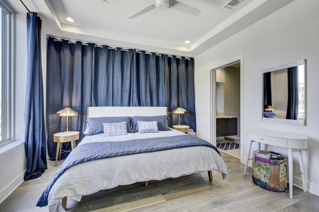 1800 E 4th St Unit 263, Austin, TX 78702 - bedroom with wood finished floors, recessed lighting, ensuite bathroom, and ceiling fan
