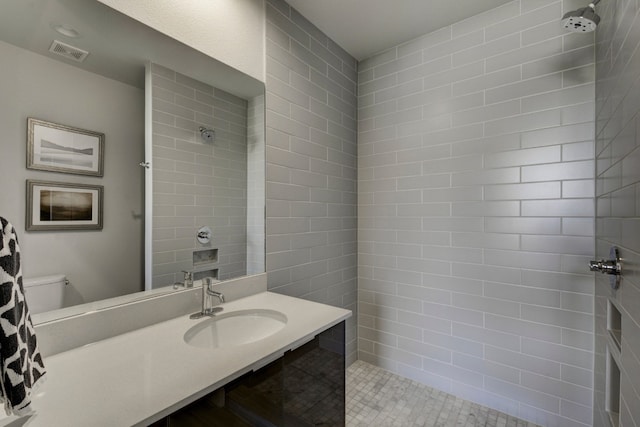 1800 E 4th St Unit 263, Austin, TX 78702 - bathroom featuring a tile shower and vanity