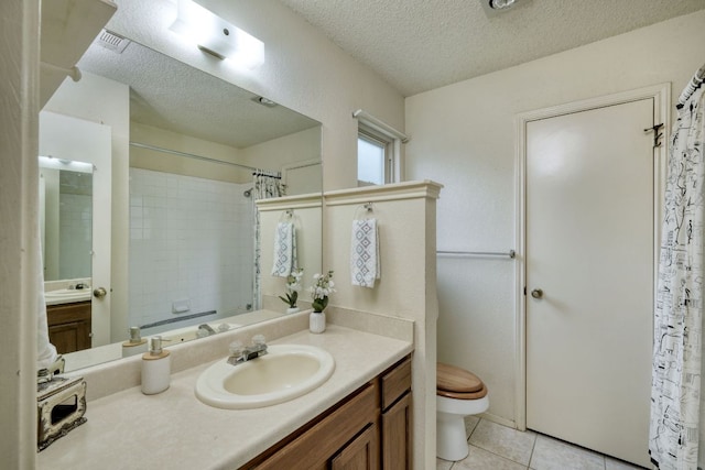 13116 Billiem Dr, Austin, TX 78727 - bathroom featuring a textured ceiling, vanity, and tile patterned floors