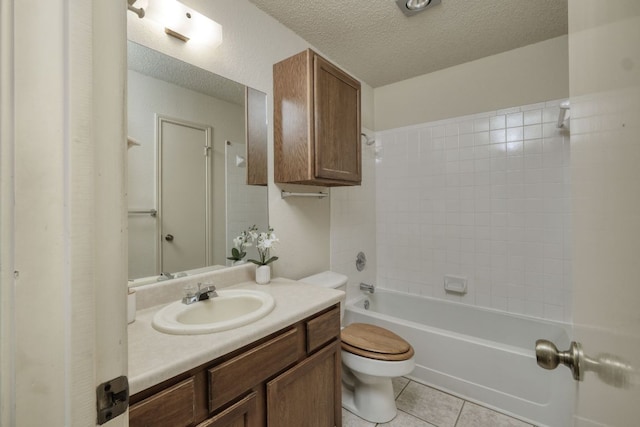 13116 Billiem Dr, Austin, TX 78727 - bathroom with vanity, a textured ceiling, tile patterned flooring, and shower / bathtub combination