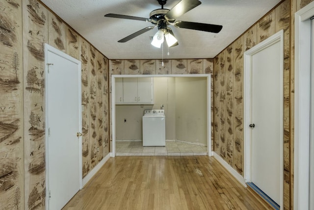 13116 Billiem Dr, Austin, TX 78727 - laundry area with washer / clothes dryer, light wood finished floors, a ceiling fan, cabinet space, and wallpapered walls