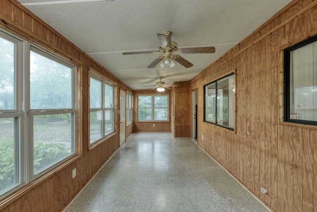 13116 Billiem Dr, Austin, TX 78727 - unfurnished sunroom with wood walls and a textured ceiling