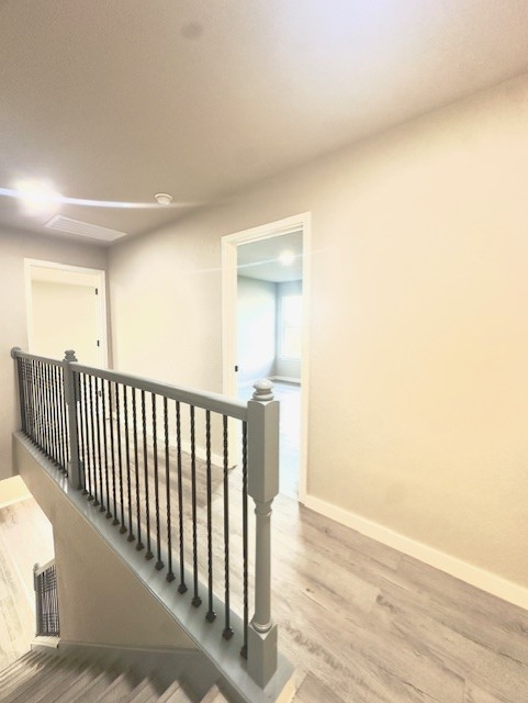 1237 Pelican Pl, New Braunfels, TX 78130 - stairway featuring wood finished floors and baseboards