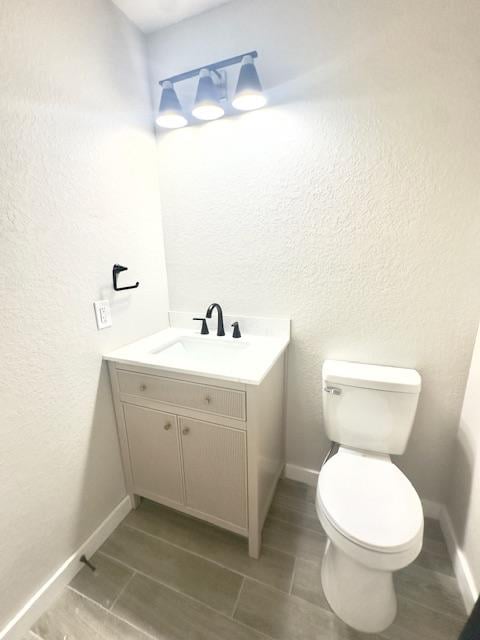 1237 Pelican Pl, New Braunfels, TX 78130 - bathroom featuring vanity, a textured wall, and tile patterned floors