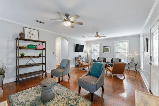611 W Johanna St, Austin, TX 78704 - living area featuring arched walkways, a ceiling fan, ornamental molding, and wood finished floors