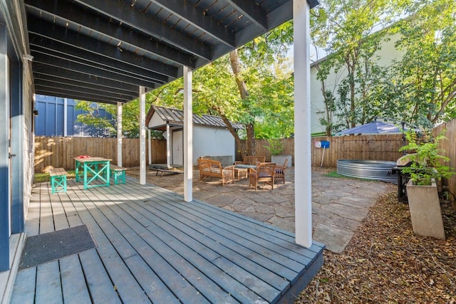 611 W Johanna St, Austin, TX 78704 - deck featuring a fenced backyard, a shed, a jacuzzi, and a patio area