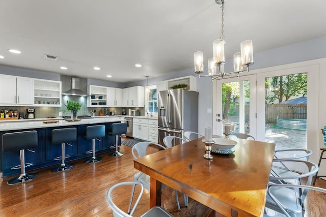 611 W Johanna St, Austin, TX 78704 - dining area with dark wood finished floors, recessed lighting, and a chandelier