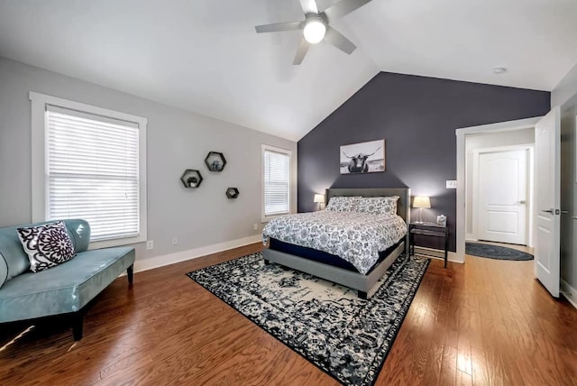 611 W Johanna St, Austin, TX 78704 - bedroom featuring vaulted ceiling, dark wood-style flooring, multiple windows, and a ceiling fan
