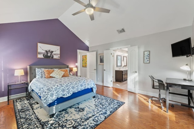 611 W Johanna St, Austin, TX 78704 - bedroom featuring vaulted ceiling, wood finished floors, and a ceiling fan