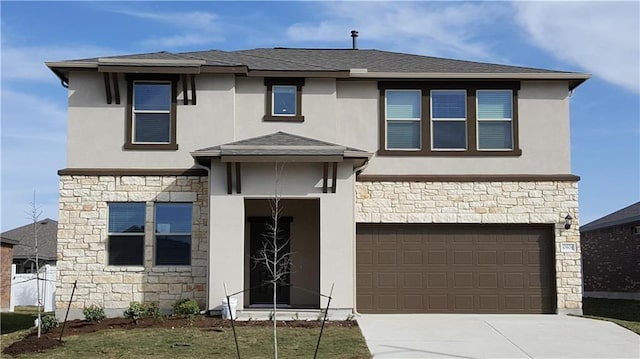 10909 Mickelson Dr, Austin, TX 78747 - prairie-style home featuring stone siding, an attached garage, stucco siding, and driveway